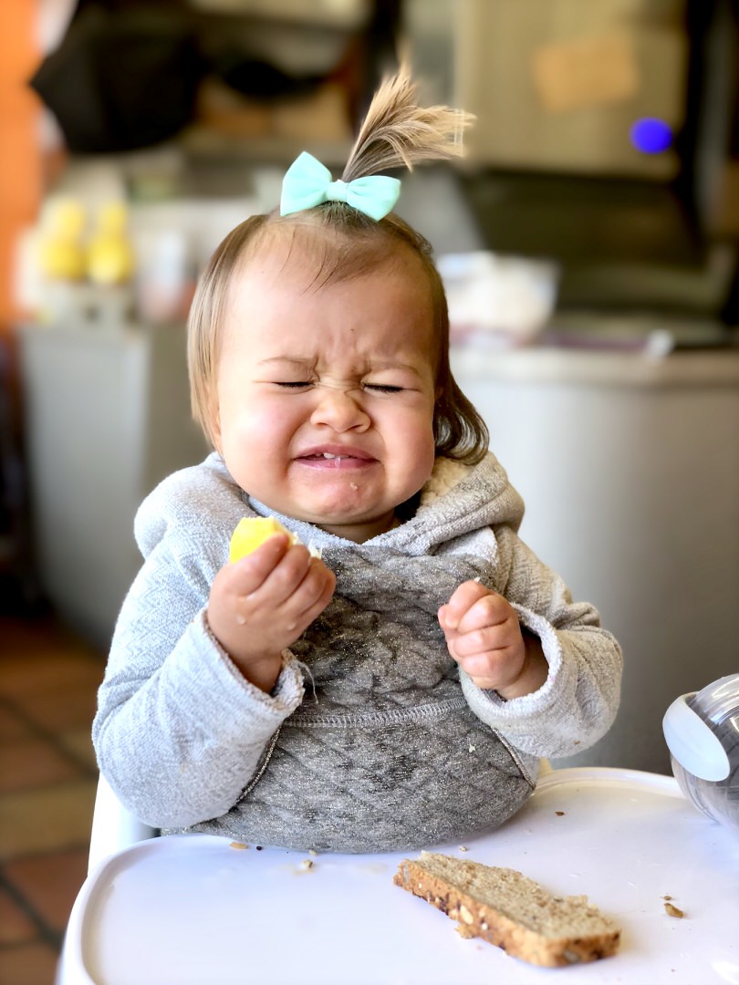 cute baby making a sour face in fresno